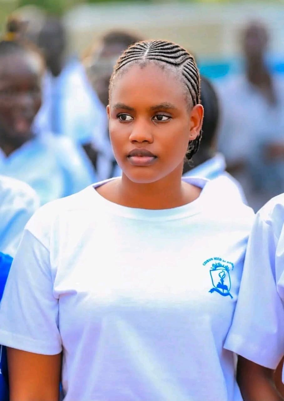 A student wearing a Gideon Seed Academy t-shirt, photographed among other students on campus